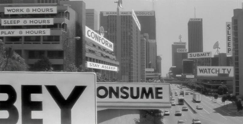 Les messages cachés derrière le paysage publicitaire du film They Live (Image : Universal Pictures).